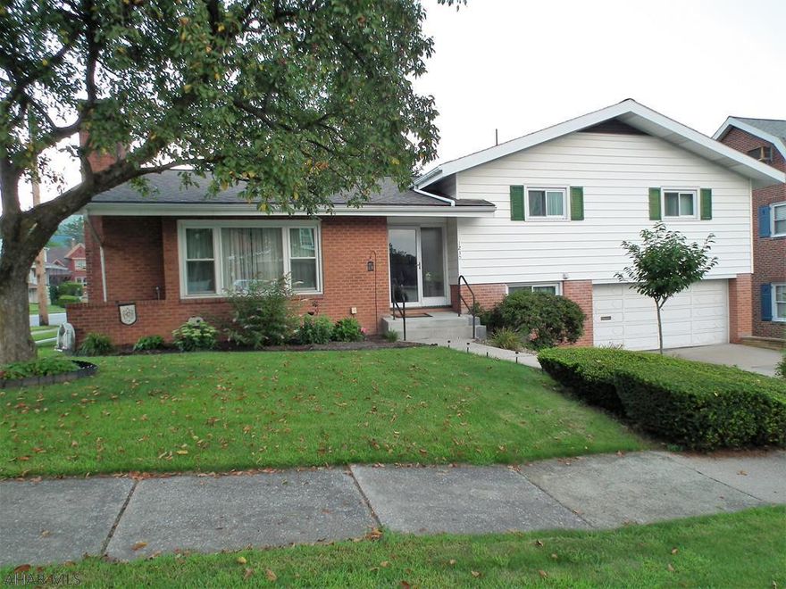 LET US PEAK YOUR INTEREST!  Corner Lot, multi level home offers 4 bedrooms, 2.5 half baths with plenty of closet space and storage.  Spacious living room with fireplace, modern kitchen with eat in, dining room,   3rd and fourth levels have additional space for a toy/TV room an  updated half bath, laundry room, lower level is a  huge family room (or man cave).  Triple lot is completely fenced in with vinyl fence. Central air, 2 car garage.