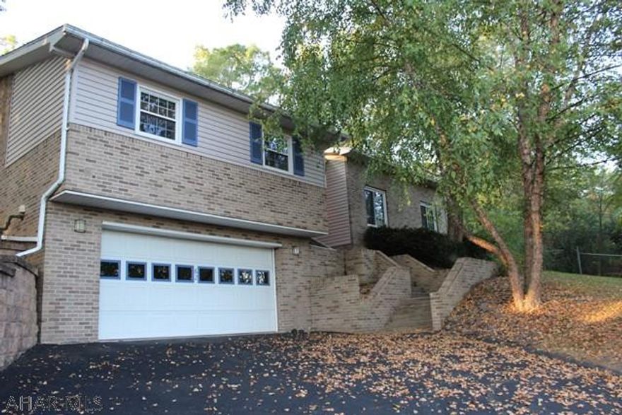 3 bedroom, 2.5 bathroom home in Holiday Manor. Large yard with awesome living space w/ a sunken family room & master bedroom, and if the  idea of a fireplace in your master bathroom sounds nice, this could be your house!  New roof and siding was put on in 2017!