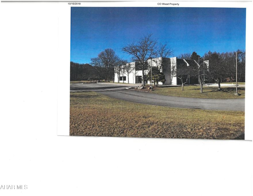 Former credit union building on approx 250 acres. Building needs renovation. OGM reserved