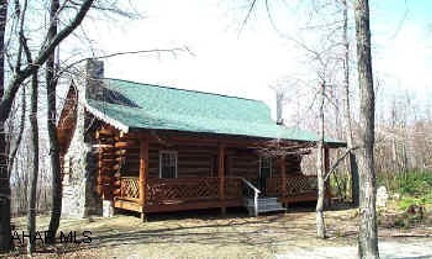 Secluded log home that is beautifully constructed with handcrafted fireplace, log walls, cathedral ceilings, deck with nice view, full basement, tiled kitchen floors, loft, chandelier.  Situated on large, all wooded lot.  Located on topof Jack's Mountain.  Please note no electric available.  From Mount Union, take Rt. 747 S 10 miles to White Road (on right).  Take right and go .2 mile, turn right, see "Private Road" sign, go .8 mile, turn left.  Follow road to "Y", take left on Eloop road, follow take laft onto Leidig Road, first property on left.
