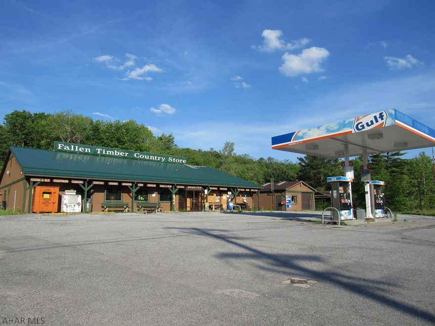 This was the former Fallentimber Country Store that had considerable fire damage in December of 2020.   Much of the building is salvageable.  Pumps and underground tanks on the site, however, they can be removed.   Also included is a nice frame storage shed.