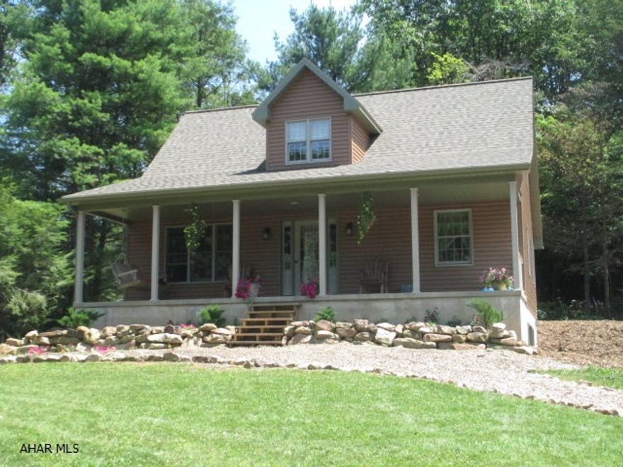 Nestled in the woods on the lower side of Pulpit Mountain, listen to the birds and the running water while relaxing on the porch. This Custom home (built in 2012) features a kitchen with hickory cabinets and granite counter tops, wood doors and trim, gorgeous master bath, large metal garage/barn, and all the benefits of new construction. Great living space with lots of light. Two story detached barn/garage is 24' x 40' with water and electric (Great for animals, a workshop, and storage). Electric heat pump keeps heating and cooling low (with backup propane furnace). Check out the location.