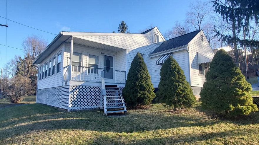 1.5 Story house in Duncansville with of street parking, driveway and carport. Spacious living and dining room and updated bath.