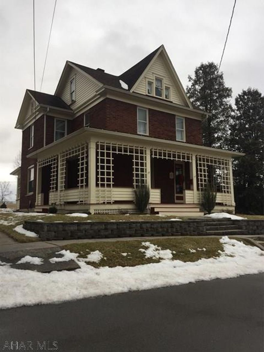 Well maintained 2-story brick home on a double lot features 3-bedrooms, 1 1/2 baths, formal dining room, enclosed sunroom, bonus room, walk-up attic, full basement with half bath and a 2-car detached garage.  Updates include 100 amp breaker service, newer furnace, newer picture windows, newer carpeting and a newer water softener system.  Other features include easy-care landscaping, ample on-street parking and a tranquil mountain view.