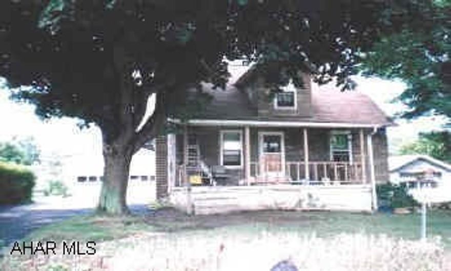 3 Br fixer-upper with 24 x 40 4 car garage, and 14 x 14 workshop.2 full baths, large lot, paved driveway.