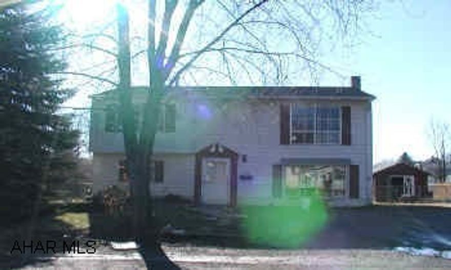 Bi-Level with 4 bedrooms, large lot above ground pool, Shed.  Woodburner. Home needs redecorated.