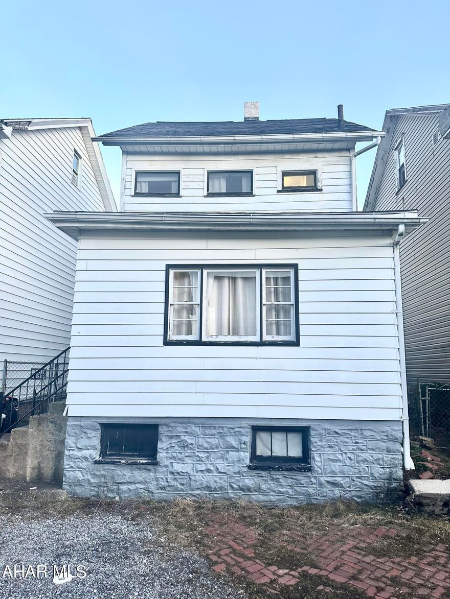 Nice 2 bedroom, 1 full bath single family starter home with 2 off street parking spaces in the alley, fenced in back yard, screened in back porch, large living room & dining room with built in corner cabinet. The walk up attic was used as a great storage space but could be finished as an extra room. Check it out!