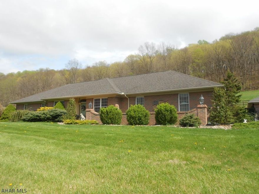 Home sits on 17.1 acres and has a barn w/ fenced pastures waiting for animals of your choice. State Game Lands right across the road! Exquisite hardwood cherry floors, designer kitchen w/ granite counters, breakfast bar. 3 bedrooms each w/ a private full bath, master features a luxury bath and a large walk-in closet. Laundry room is on the main level. Large foyer entry, office w/ built-in book cases, formal dining area and comfy living room w/ brick wood fireplace. Home has geo thermal zoned heating and air, central vac, built-in sound system and custom wood blinds. Extra full bath for guests, huge family room w/ wet bar for entertaining, not to mention the back covered patio area which is a beautiful private outside oasis. 2 car brick detached garage w/ a place beside to park your RV.