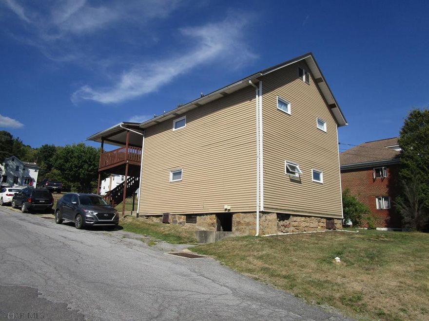 Remodeled duplex with alumn siding and newer metal roof. Each unit contains 2 brs, oak kitchens, living room and bath.  Separate utilities except heat (1000 gal buried tank).  Large rear covered deck and off street parking. Live here and let the tenant pay towards your mortgage or use as investment.