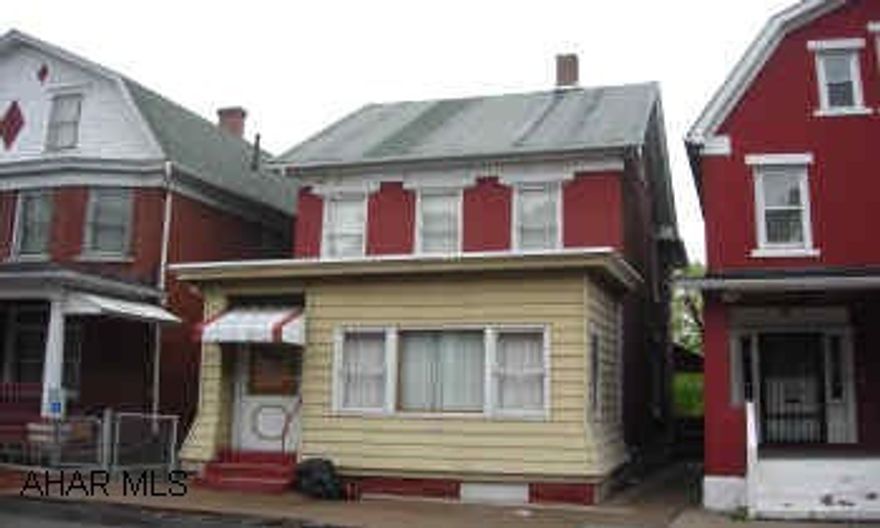 2 1/2 STORY BRICK.  GAS HOT WATER WITH CENTRAL AIR. STATELY 2 1/2 STORY BRICK.  3 BEDROOM, 1.5 BATHS.  HOT WATER HEAT W/ CENTRAL AIR.  NEWER WINDOWS, ENCLOSED FRONT PORCH.  LARGE KITCHEN.  PRICED RIGHT.  $2000 ROOF ALLOWANCE.  HOME WARRANTY INCLUDED.