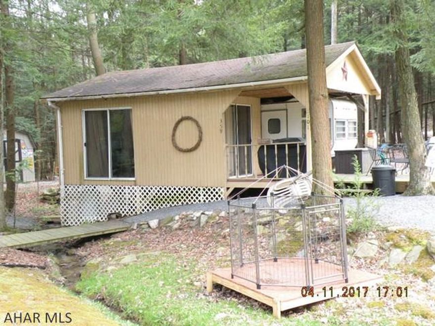 Cute camper with addition on a great lot, within walking distance of the pond. Sleeps 8