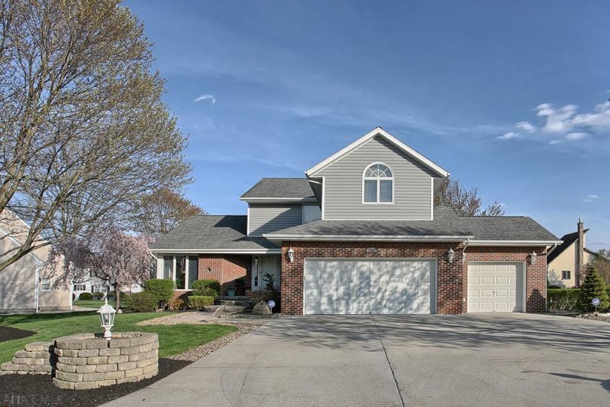 Gorgeous, high quality home.  The tile entry leads to a mostly open floor plan with vaulted ceiling.  The kitchen/family room combo is stunning w/ hickory cabinets, silestone counter tops, high end stainless appliances, and beautiful lighting.  Convenient 1st fl laundry and 1/2 bath.  The second level features a well designed loft office, master BR with double door entrance, HW floors, vaulted ceiling, granite counter top on double vanity, Jacuzzi tub, shower w/ rainfall shower head.  There are two additional BR's and full bath on this level.  The lower level features a family room with gas FP, a game room w/ wet bar and refrig, and a 3/4 bath.  Outdoors features covered deck,  heated in ground pool w/spa, pool house w/changing room & 1/2 BA.  HOME WARRANTY W/POOL & SPA COVERAGE INCLUDED.