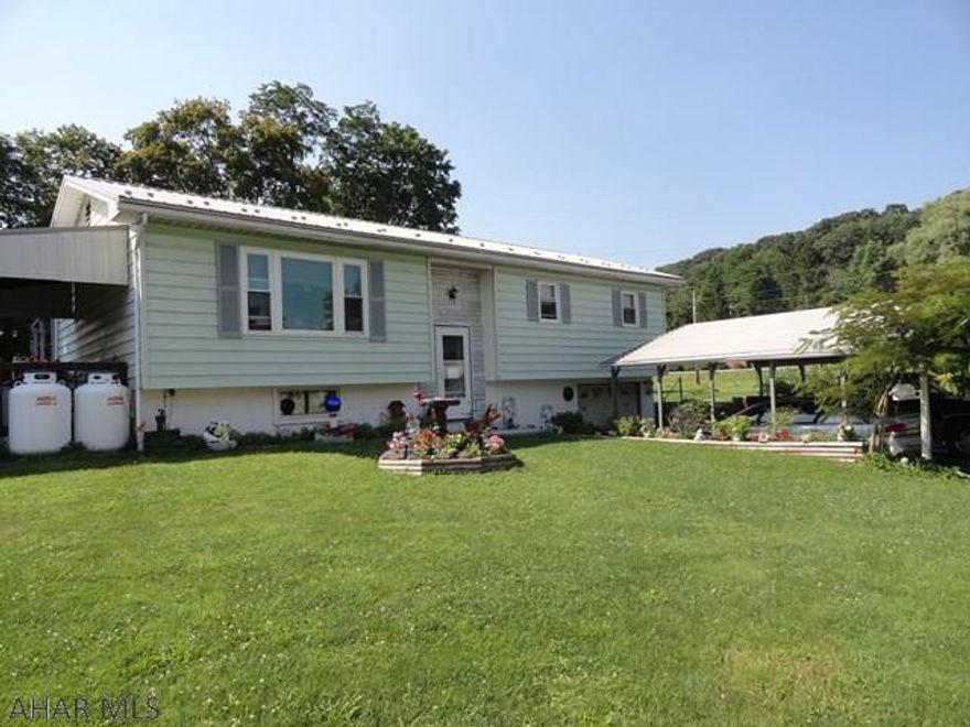 Spacious 3BR 1.5BA on over 1 acre, newer roof, furnace & windows, 2-tier deck for entertaining, 1 car integral garage plus 2 car carport & 2 sheds for storage.