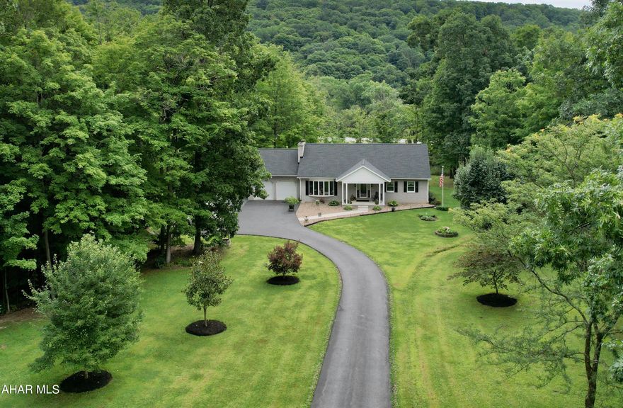 Feel the warm embrace as you enter the stone entrance of this lovely property set on 2.6 acres.  The tree lined driveway opens onto a charming home built by one of Bedford's finest builders. It's a Bill Waltman quality home that has been meticulously maintained and beautifully updated with gorgeous hardwood floors, new kitchen, baths, roof, heating system and so much more.  If you love spectacular sunsets and sunrises, this home will not disappoint.  Your evenings will be graced by some of the most amazing sunsets while your morning coffee on the back deck will be home to wonderful sunrises.   This is one story living at its best and this one will not last long!--
