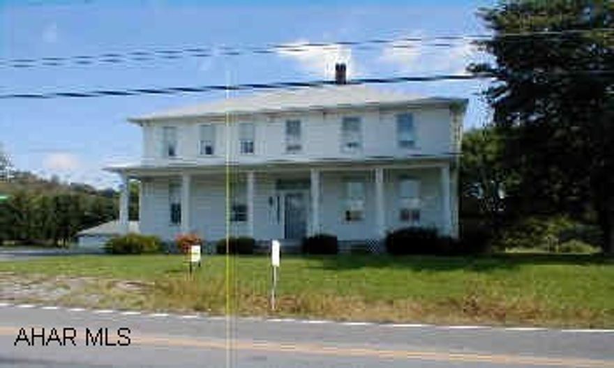 2 story 1870 Federal style home. Lovely Old Home!   7 miles from Blue Knob Ski Resort. An ideal location for an antique shop & residence (formerly a home & store). Circa 1870 features include: spacious rooms, high ceilings, nice wood floors & trim, 3,000 +/- sq. ft., attic storage. Most walls/ ceilings in the residence have been re-plastered. 1995 roof, maintenance free siding, and storage and garage buildings.  .....A nice property with a large, 0.8+/- acre corner lot & 2 storage bldg's for your business inventory. Reduced to $84,900  As Is.