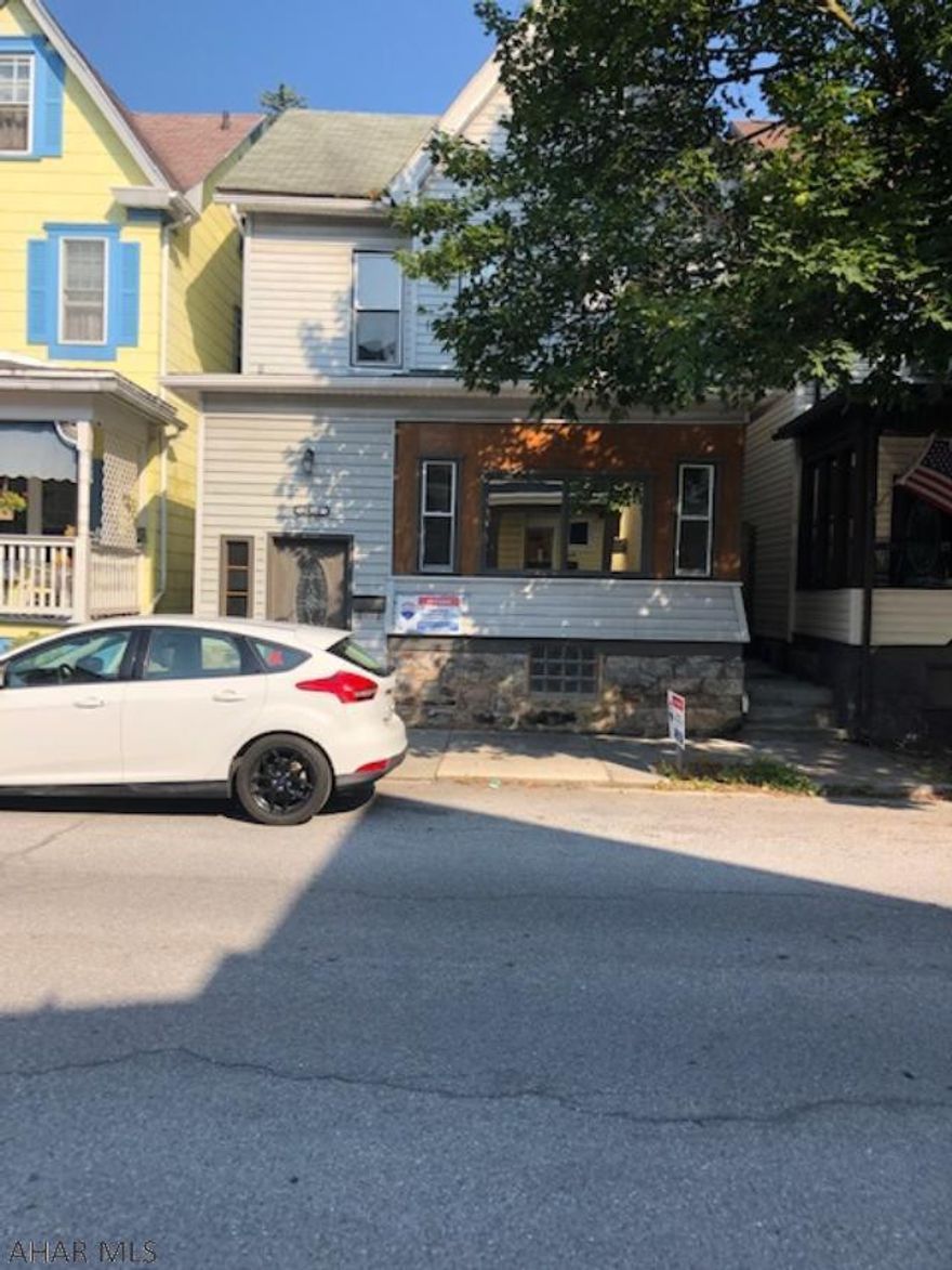 Walk into the grand entrance oak stairway to this 3 bedroom 2 full bath with many modern updates.  Beautiful ceramic tile floors, gas fireplace, large fish tank, newer kitchen and 1st floor bath, 1st floor laundry room.  This is a must see property with very low taxes, C/A and fenced yard.