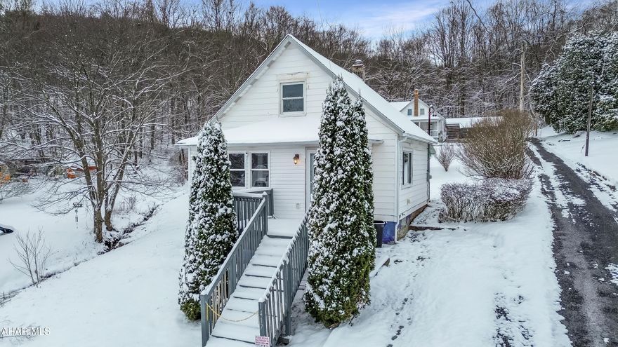 Welcome to 1417 Short Street in Nanty Glo! This charming Cape Cod-style home is situated on a private corner lot and offers a blend of comfort and recent updates throughout. The main level features a spacious mudroom, a bright and inviting living area, a large eat-in kitchen with included appliances, convenient first-floor laundry, and a beautifully updated full bathroom. Upstairs, you'll find two generously sized bedrooms with plenty of natural light. The unfinished basement provides excellent storage space and includes updated electrical, a newer hot water tank, and additional mechanical improvements. Outside, enjoy a welcoming front porch, a covered rear patio perfect for relaxing or entertaining, a large yard, and off-street parking. This well-maintained home has plenty to offer. Schedule your showing today!