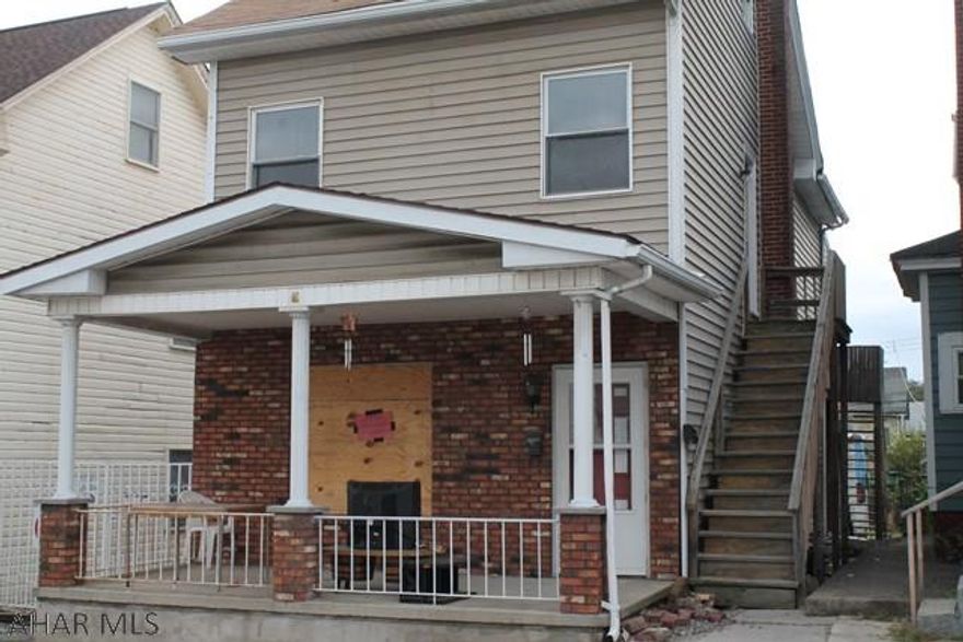 This is a chance for immediate income.  The 2nd floor, 2 bedroom unit is ready to be rented out. The first floor needs some TLC but could be ready quickly.  Lots of Off Street Parking in the Rear.  Great for someone to add to their portfolio of rentals, or to live in one unit and rent the other unit. Unit is being sold As Is.