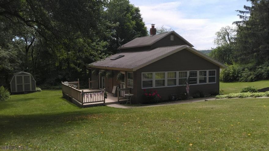 Inviting  3 bedroom 1.5 bath home nestled on a 0.7 acre lot bordering Summit Country Club.
