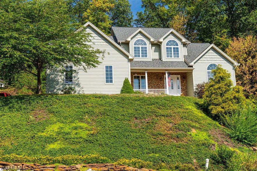 Enjoy the spectacular view from this tastefully decorated home, snuggled in the hillside, private and peaceful.  Newly remodeled Kitchen, Master bath and Basement. Rooms are spacious with 10 ft. ceilings with crown molding in the Master Suite, and Cathedral ceiling and gas fireplace in the living room. Dining Rm is open concept with pillars (w/ serving closet) that opens to the newly remodeled kitchen and sliding glass doors to a lovely screened-in porch. Don't miss the 1st floor Master Suite with stunning, newly remodeled Master Bath. 1st floor Laundry. Basement just finished with ship lap includes Work-out Rm/ FamilyRm, Craft Rm, Theatre Rm,  and  awesome Work Shop. Venture up the rear path to a clearing to enjoy tranquility and take in the view. Heaven! Call Ellen for you personal tour!