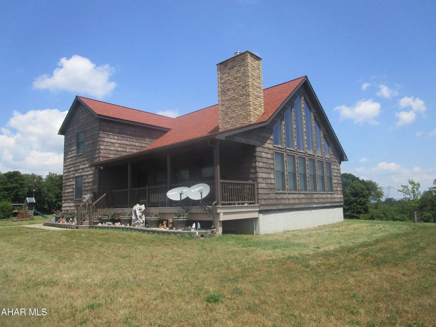 Custom built two story home on 45 acres. This home is quality construction throughout. Home features include 4 bedrooms 3 baths living room with fireplace and large windows overlooking a million-dollar view. Vaulted ceiling and oak kitchen. Second floor loft area and master bedroom with jacuzzi, steam shower, walk in closet and office . Full basement includes family room with fireplace, 3/4 bath and bedroom or office. Oak trim throughout and ceramic baths. Two 1,000 gallon propane tanks for the HW heating system. Central vac, generator hookup, security system and free internet.  Remodeled bank barn used for storage with concrete floor, rewired and alarm. Chestnut, apple, pear, cherry and peach trees along with blueberry bushes.  Nice private country setting with unbelievable view.  Gas rights not included in sale.