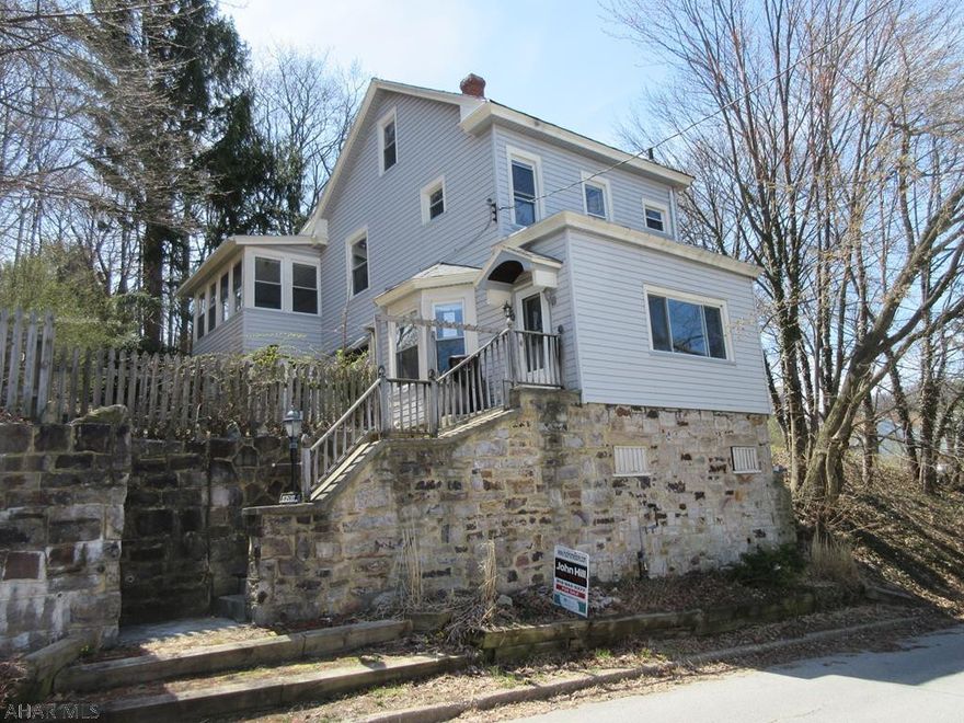 A rare find - larger private lot for this in-town Altoona 2 story home. Eat-in kitchen with center island, large living room with bay windows and formal dining room. 4 large bedrooms (1 captive), finished attic, large wood deck, vinyl siding and windows. Property sold AS-IS. Seller will make no repairs. Offers must be submitted through HUD approved broker. Buyer pays both transfer taxes. Equal Housing Opportunity.