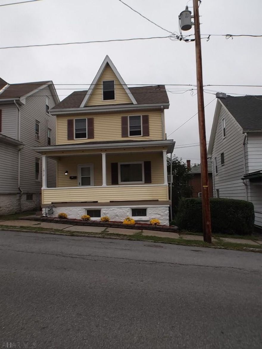 Move right in to this 3-4 bedroom 3 story home!  Attic is finished for the 4th bedroom and it is huge. 1.5 baths. Whole house has been freshly painted inside   Mostly all new flooring throughout. A nice front porch to sit and enjoy the fall evenings. There is nothing you need to do but move in! Roof is only a few years old. Small fenced in back yard.  3 window A/C units stay.