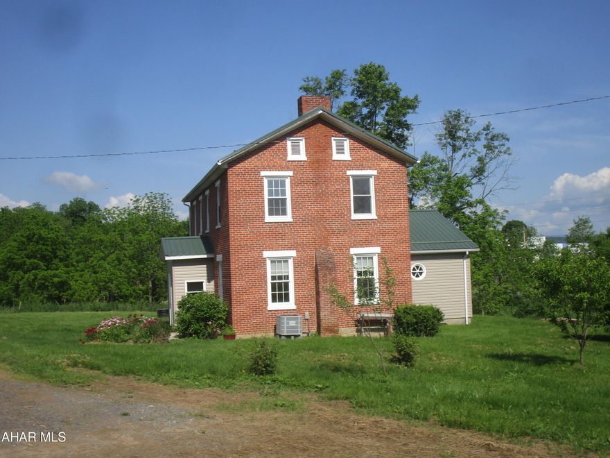 Actual age of 2-story brick house is believed to be in the 1880's.  Updates: Kitchen cabinetry; 2 baths (1 w/ laund. hook-ups);  vnl. laminate flooring; interior paint; Bosch heat pump w/ CA.   Stg. bldg. is former conc. block milk house.

For Comp Purposes Only