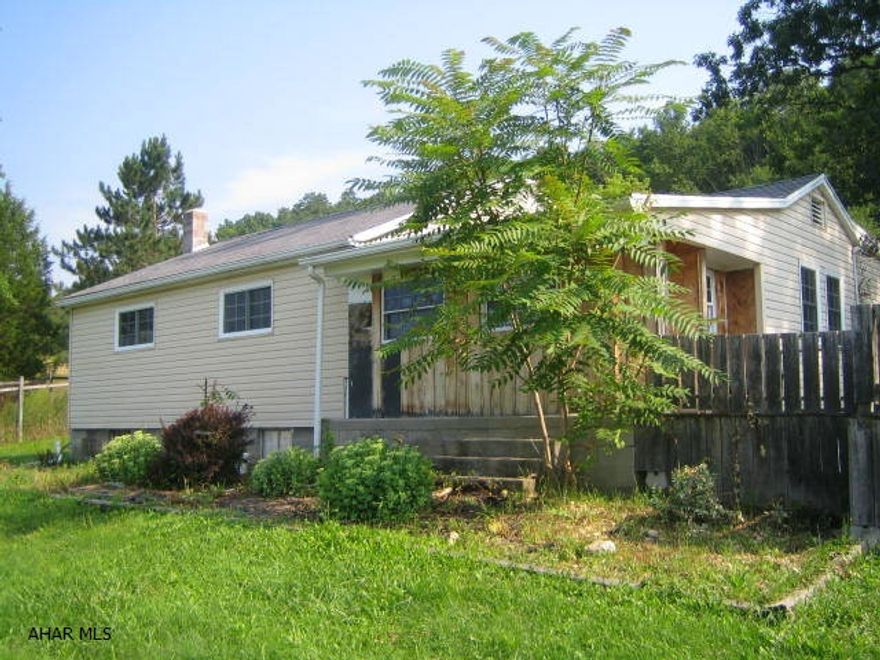 Hollidaysburg fixer-upper on 1 acre. Nice sized 1 story features 4 bedrooms, large living room and family room with fireplace. Large level lot. Needs work throughout. Great location!