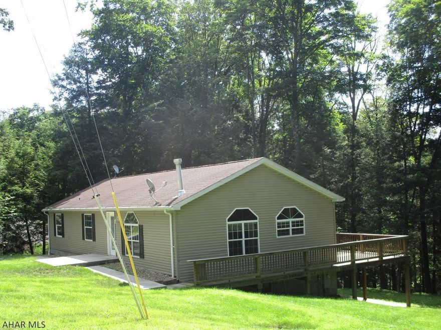 Attractive double wide on a full foundation and large lot.  The home features a large living room with fireplace and vaulted ceiling, oak kitchen with center island and vaulted ceiling and EI dining area, master bedroom with 3/4 bath and walk in closet, basement family room with pellet stove and walk out to rear patio. Stone fire pit. Great home for the money with all amenities of Glendale Yearound!!