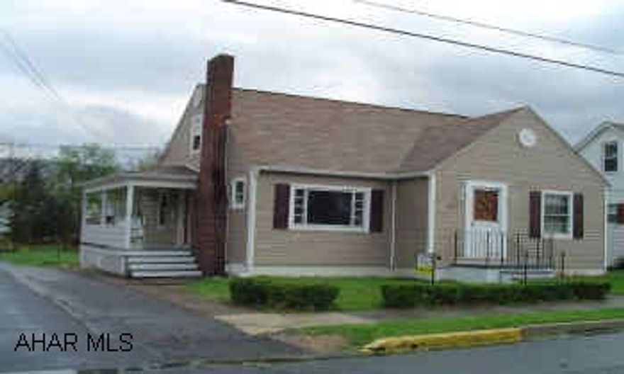 Sold As Is. 1 1/2 story vinyl siding, full basement with walkout, brick fireplace, and on a level corner lot.