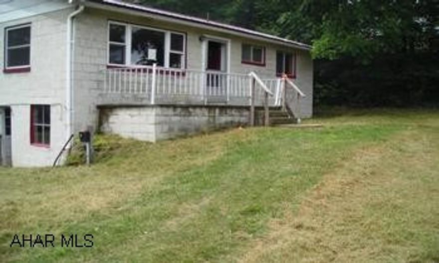 See Comments 2 bedroom block home on 1.8 acres in need of complete rehab, several outbuildings.