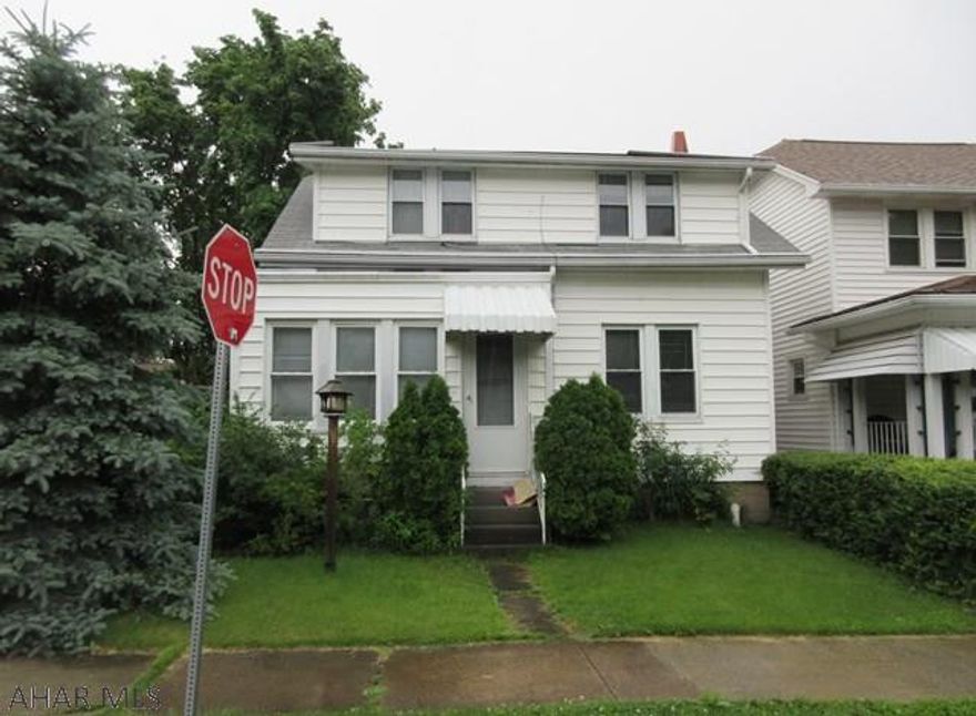 Juniata area home in nice area. Needs TLC. Detached garage (across the street) on separate lot included in sale. AS-IS sale. Seller will make no repairs.
