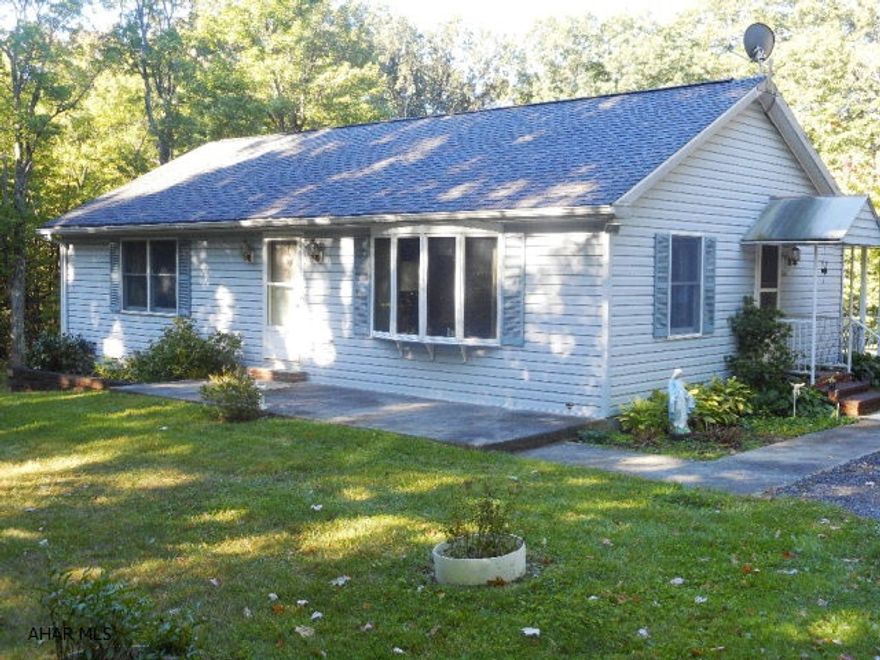 This 3 bedrm, 2 full bath one story home has a beautiful, private wooded setting on 2A in Logan Township.Spacious eat-in kitchen, dining rm, living rm and ample size bedrooms with nice closet space. Partially finished daylight basement with family rm, bedrm, full bath. Additional features are a detached 40x24RV port/Carport with power for hook up in place. Carport has multiple uses for storage of up to 4 cars, utility truck or vans, campers or 5th wheels.16x23 covered back porch with concrete floor with extra storage underneath  Det. shed can be a great workshop. Even in this private wooded setting, you are still minutes to everything. Don't wait and miss this very special property. Per tax assessment est. 2017 taxes are estimated at $1673.