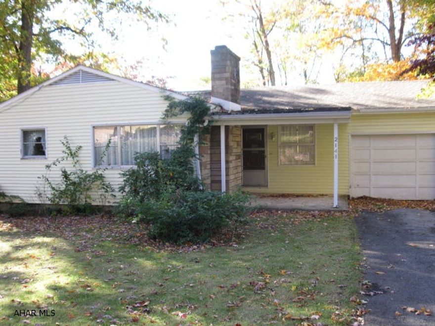 Investor/Contractor.  Sweet rancher on lovely 1/3 Ac. lot in Hollidaysburg School District.  3 bedroom, hardwood floors, large cut stone wood burning fireplace. Full partially finished daylight basement for additional living space.  Original kitchen and bath.  Gas hot water heat.  Newer roof and vinyl siding.  1 car garage. Serious issue with foundation. Electric 100 amp fuse. Will NOT qualify for FHA financing. Being Sold As Is.