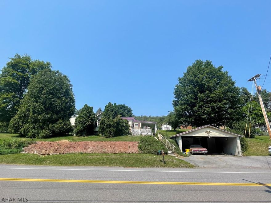 This ranch home sits on an irregular shaped .5 acre lot in Portage Township.  4 bedrooms, one that is captive and 1 full bath.  Nice sized living room.  Enjoy the covered back porch all year long.  Carport.  Newer metal roof, newer furnace.  In the process of getting sewer compliance certificate.  Property being sold as is.