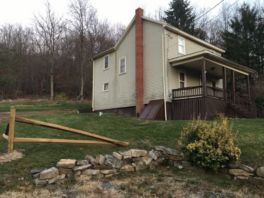 Move-in ready, charming, updated country home with 3 bedrooms, 1 full bath on 1.75 acres!  This home features a roomy updated kitchen with newly sanded and stained hardwood floor, remodeled full bathroom, new carpet in the dinette and upstairs bedroom, and new Kinetico water filter system.  Perfect property for year round living or for the hunting or fishing enthusiasts!  Beautiful mountain views, close to Raystown Lake.