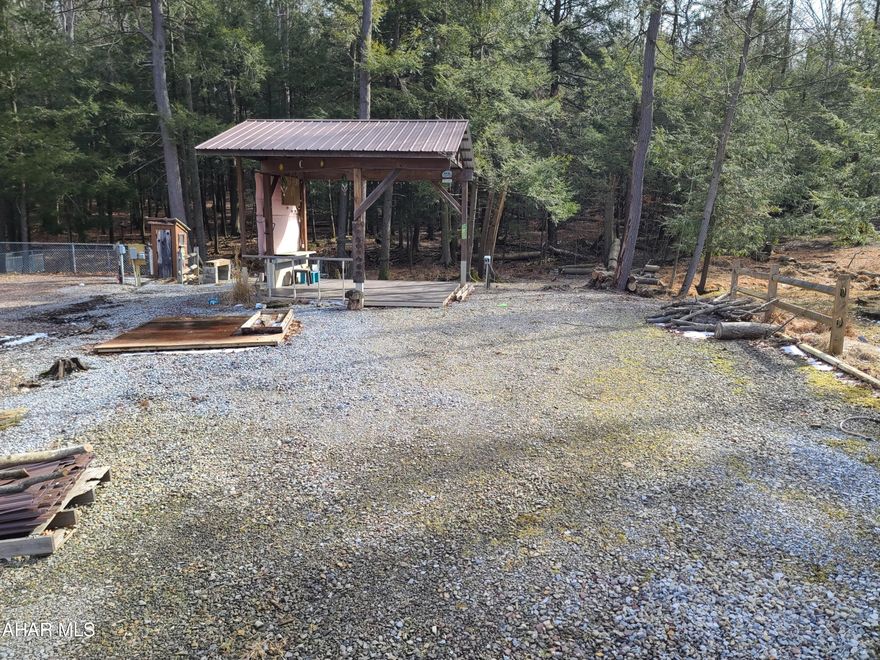 1 vacant campsite located in Glendale Yearound. Beautiful lot at back of circle with small pavilion on it. Small stream runs thru the back of property. Public water and sewer.  30 amp service on site. Glendale Yearound is a gated community located minutes away from Glendale Lake and Prince Gallitzin State Park.