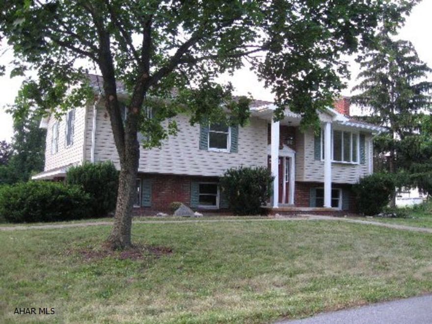 Hollidaysburg Boro! TOTALLY NEW EXTERIOR including roof, siding, pool liner, fence, deck and central air, and INTERIOR includes new kit, baths, all interior doors,trim, fixtures, appliances, 4 new garage door openers and flooring. Awesone family home. Walk to Blairmont golf, YMCA, schools and churches. 3 bed 2.5 bath home on large level corner lot.  2 car intregal garage plus HUGE 2 story garage for 2 more cars with 2 upstairs rooms for 2nd story workshop, storage, or huge gameroom. In ground pool,fireplace. Gas forced air heat,central air. Large deck joins house and garage/workshop and pool. DON'T WAIT!