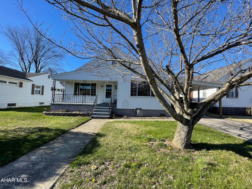 This beautifully maintained home sits on a level fenced lot in Duncansville Borough and is larger than it looks!  Step inside into a bright and airy home with large picture windows that are in both the living and dining rooms.  The updated kitchen offers plenty of storage with pantry cabinets and includes updated appliances.  There are 3 spacious bedrooms, one with a door that leads to the back yard.  A first floor bathroom complete this floor.  Walk up attic for plenty of storage.  Higher ceilings in the basement gives the space potential for additional family living area.  Newer furnace and hot water heater.  Carport for covered parking in the winter.  Entertain family and friends on the back patio all summer long.  Call to schedule your personal showing.