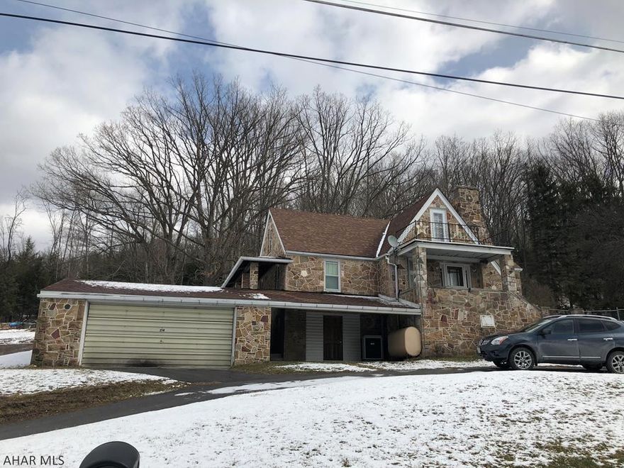 Solid and well built stone house in beautiful neighborhood. This 4-5 bedroom home has unlimited potential. A little updating and sweat equity will make this house a STUNNER. 2 car garage with fall out shelter, almost an acre of land partially fenced, C/A, New coal/wood furnace to supplement the oil furnace, newer roof, some new thermo windows, hardwood floors, gas FP, upstairs kitchen could stay or easily go , 2nd floor balcony, covered porch, awesome views, you really need to see this property to get the full potential.