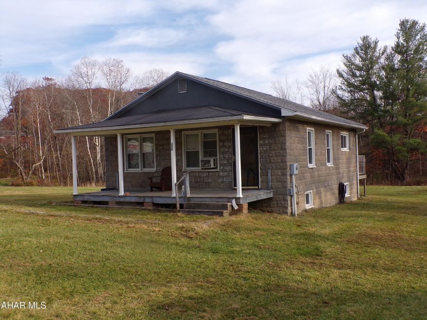 Potential galore in this 2 bedroom bungalow situated on a large 2.54 acre lot in Antis Township.  Dwelling needs some work as does the garage.  Make this one your own with a little work.  Great location and desirable neighborhood.
