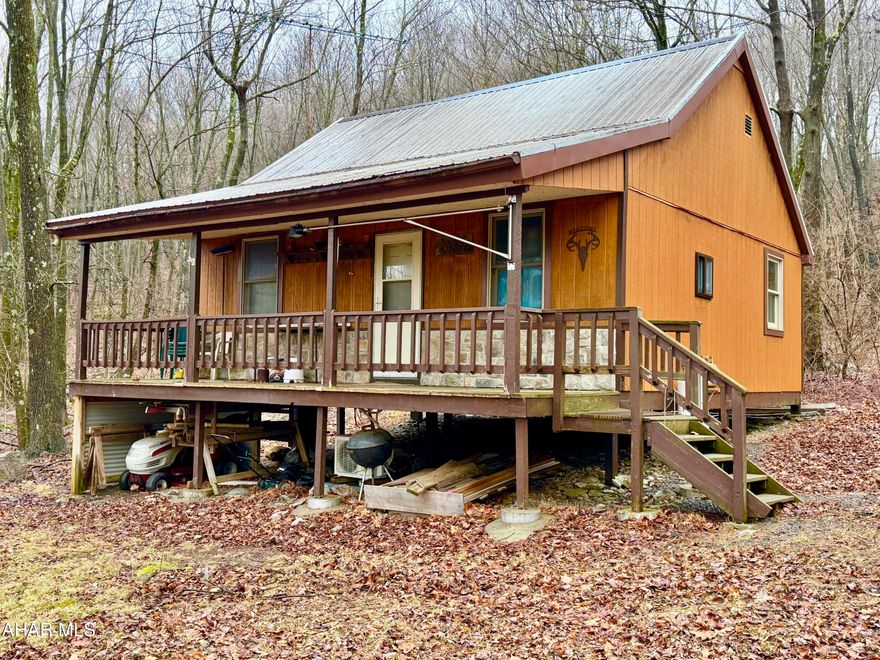 Escape to nature with this secluded cabin situated on 2.7± acres. Located just minutes from Buchanan State Forest and the Pike 2 Bike Trail, the private setting offers the perfect escape while still providing easy access to the Pennsylvania Turnpike, Interstate 70, and U.S. Route 30. Property currently has no well or septic system.