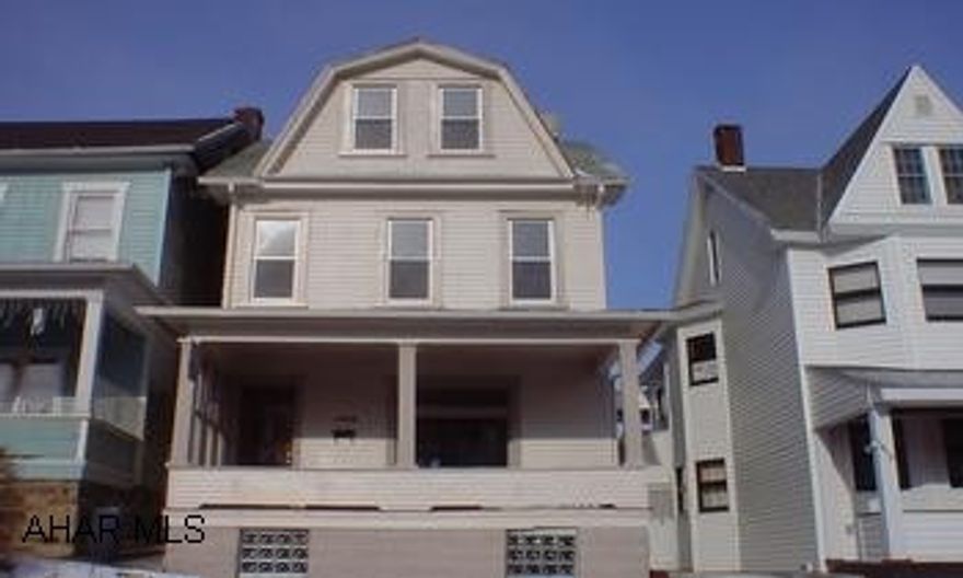 Spacious 4 bedroom, 1.5 bath with finished, heated 3rd floor. Features hardwood floors throughout, leaded windows in living room, 1st floor laundry & half bath, brand new custom kitchen with center island, and deck off of master bedroom. Freshly painted inside & out. Level yard with off-street parking.