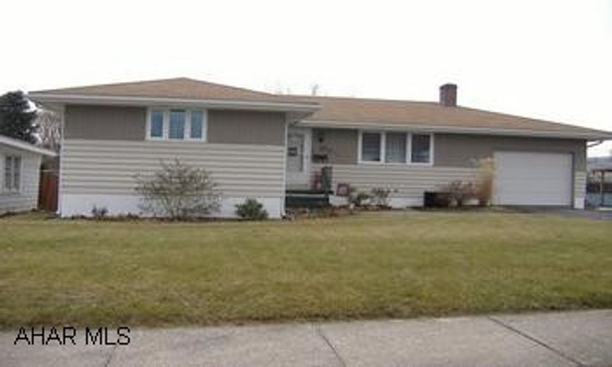 LOVELY HOUSE IN THE BORO OF ROARING SPRING ...BEAUTIFUL HARD WOOD FLRS....NEW KITCHEN...NEW 2 CAR DETACHED GARAGE PLUS A 1 CAR ATTACHED...3 BEDROOM...LARGE BASEMENT COME ON MOVE TO THE COVE......