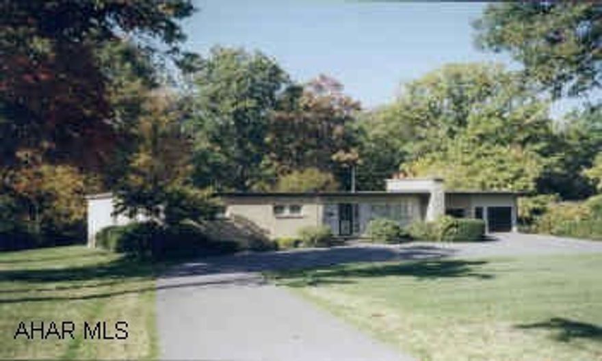 RANCHER ON APPROX. 1 ACRE OF BEAUITFUL WOODED GROUND.  SECURITY SYSTEM.