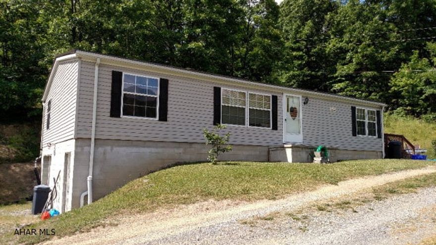 2003 Fleetwood-28X48 on foundation w/1 car integral garage, full storage w/walkout basement, above ground pool w/all equipment.