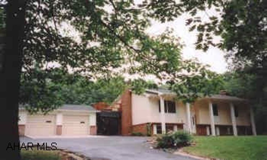 Altoona Schools -Beautiful grounds- 3.5 acres - large home - 3BR, 3BA 2/c garage, carport,decks, garden area, stream fed irrigation system. Altoona Schools-Tyrone TWP-3.5 Acres, newer roof, zoned hot water furnace, large master suite, with bath and deck, newer roof, zoned oil-HW furnance, all appliances, stream on property and stream fed irrigation system.  2/c garage/workshop and carport.