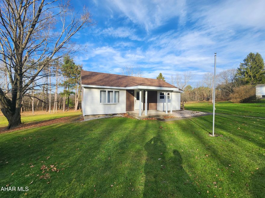 Come check out this adorable country home.  This updated ranch style home has updated electrical, heating, and hot water tank.  The detached 2 car garage is very spacious with a full loft for storage. The wrap around, covered porch has wonderful views of the countryside. 
This house is move in ready! Only minutes from State Game Lands and Prince Gallitzin State Park!