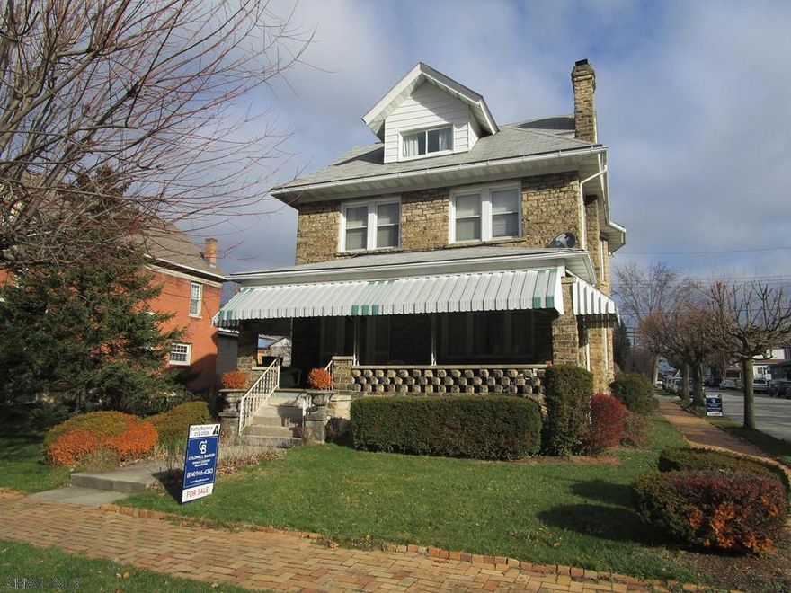 Corner lot. Stone home. 2 car detached garage. Fireplace-wood & coal. Sold As is